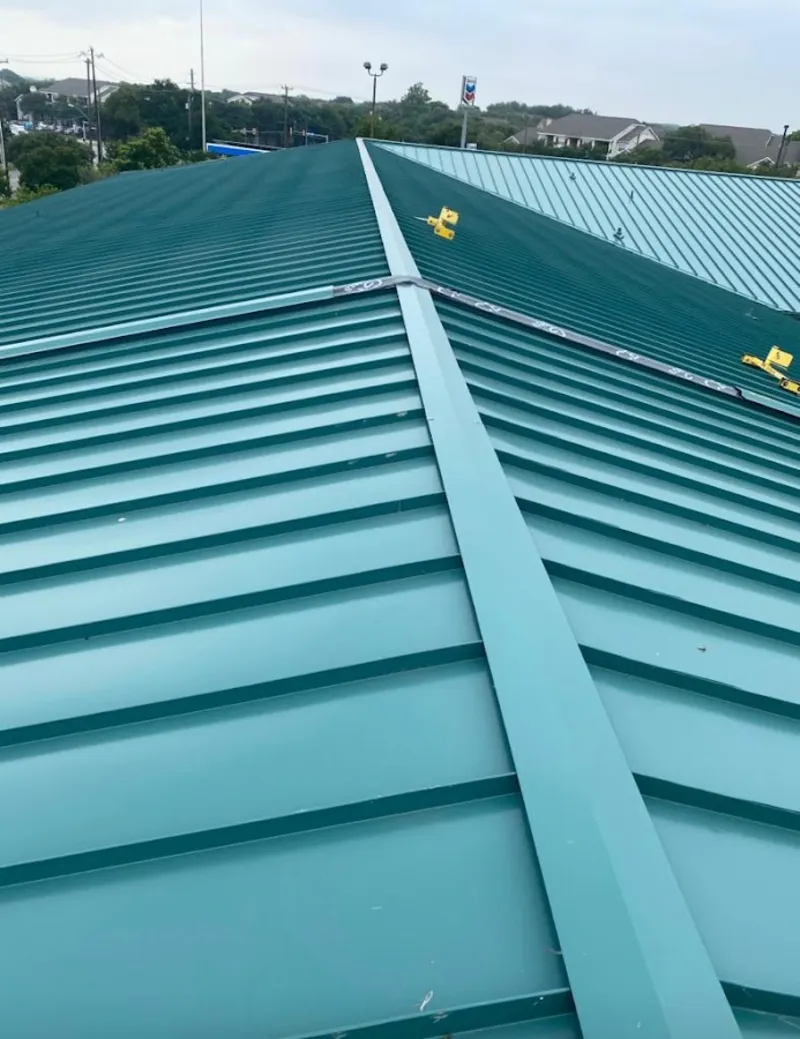 Green commercial metal roof ridge and valley for Metal Roof Repair in Guadalupe