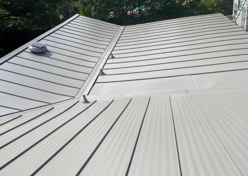 Solar attic fan installed on a metal roof for Roof Ventilation in Guadalupe